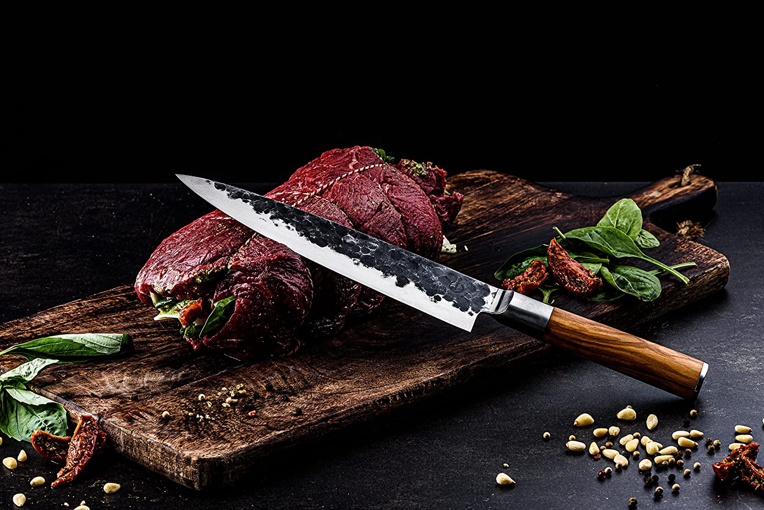 https://www.woklove.com/wp-content/uploads/2022/06/Forged-Olive-Chefs-knife-cutting.jpg